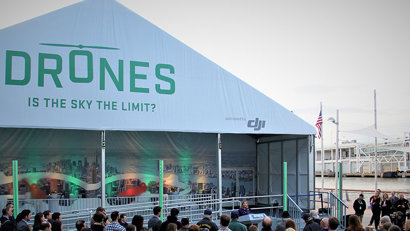 A large outdoor tent at a drone event titled 