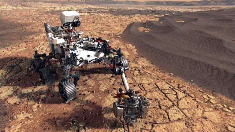 A Mars rover is pictured traversing a rocky surface, equipped with scientific instruments for exploration and data collection. Arid, rugged terrain stretches into the background.