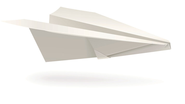Image of a simple white paper airplane in mid-air against a plain white background.