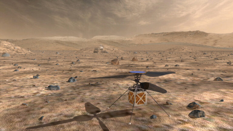 A small helicopter-like drone with two rotors sits on the rocky, barren surface of Mars with a distant rover in the background under a cloudy sky.