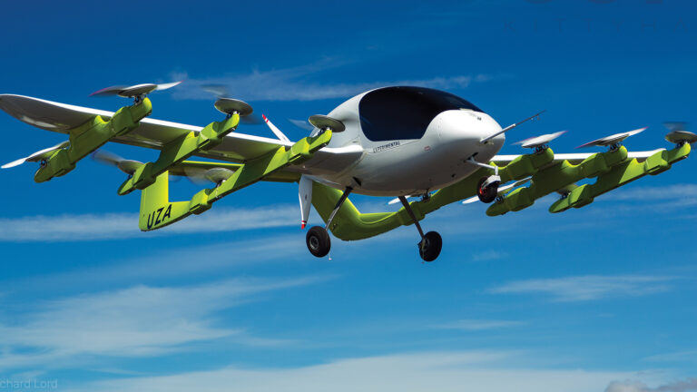 A green and white airplane flying in the sky.