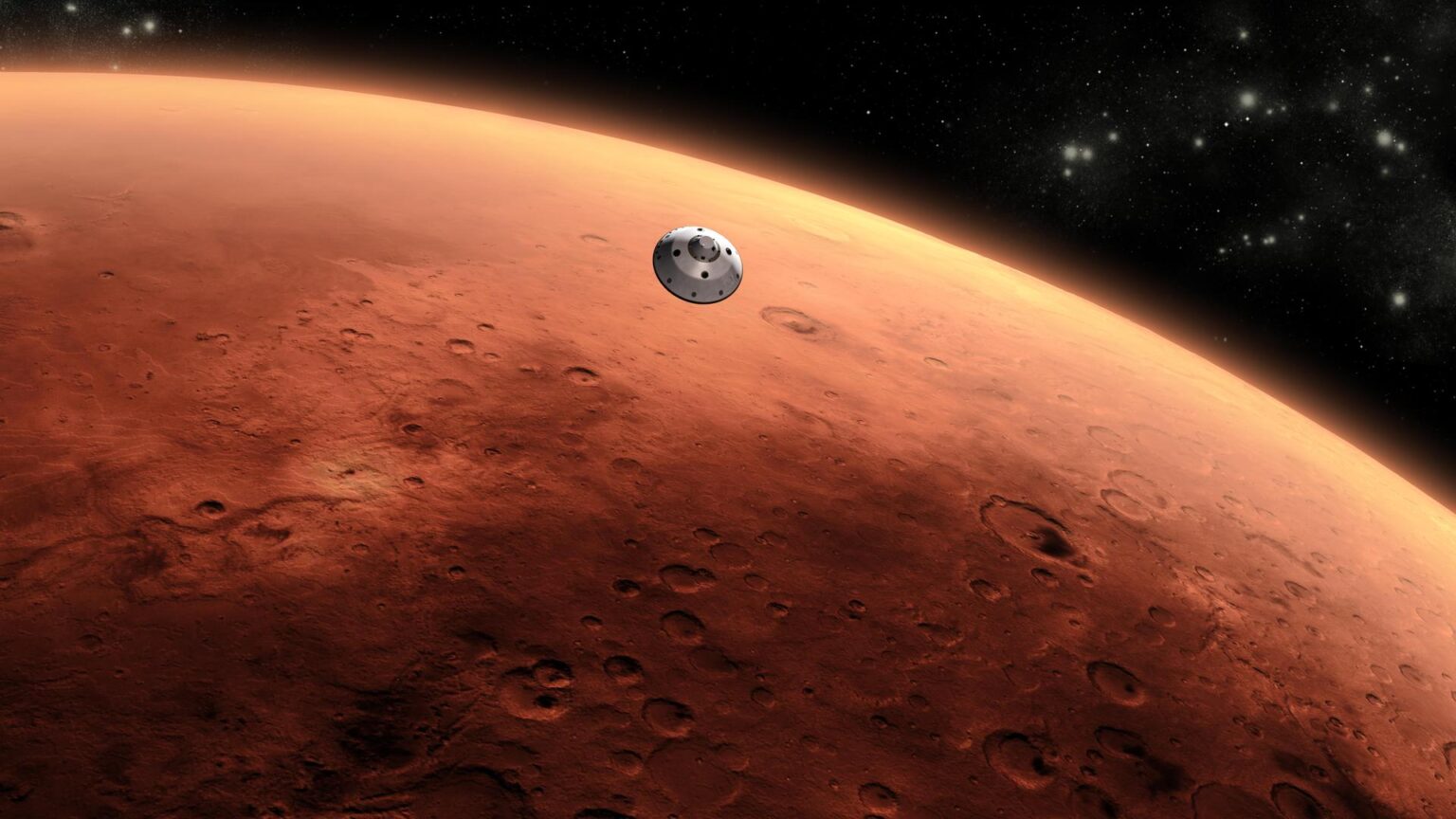 A spacecraft approaches Mars, with the planet's reddish-brown surface and craters visible and stars in the background.