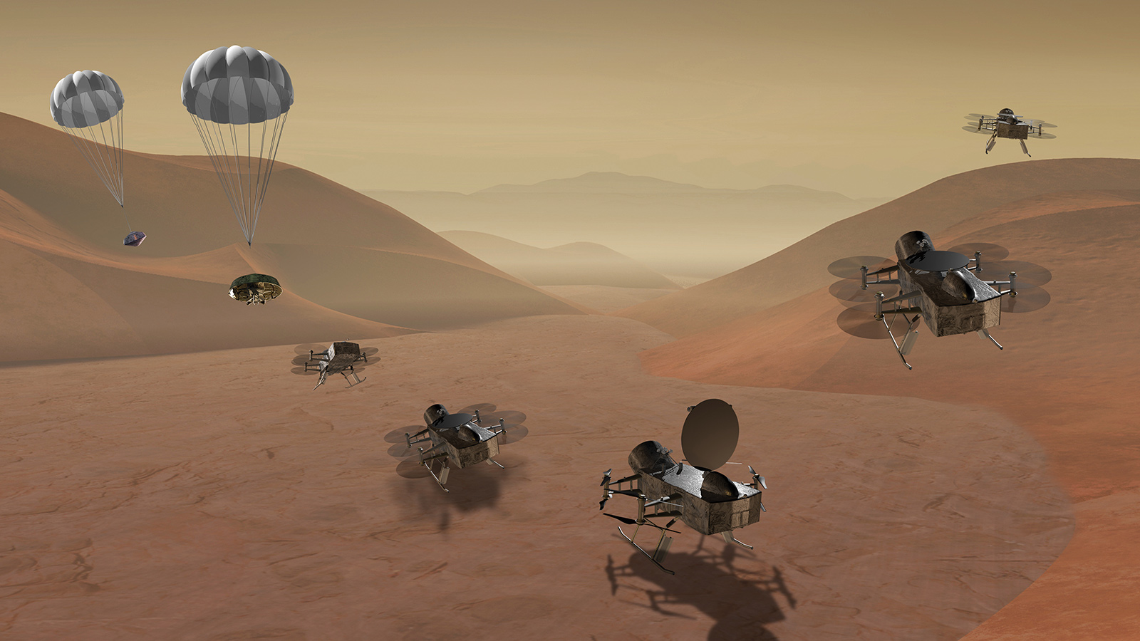 A group of drone-like spacecraft explore a desert landscape, with some descending by parachute and others flying close to the ground. The terrain consists of reddish sand dunes and a distant hazy horizon.