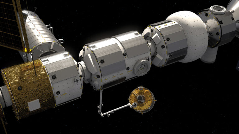A detailed view of modules of the International Space Station connected in space, with a mechanical arm extending toward a small robotic module.