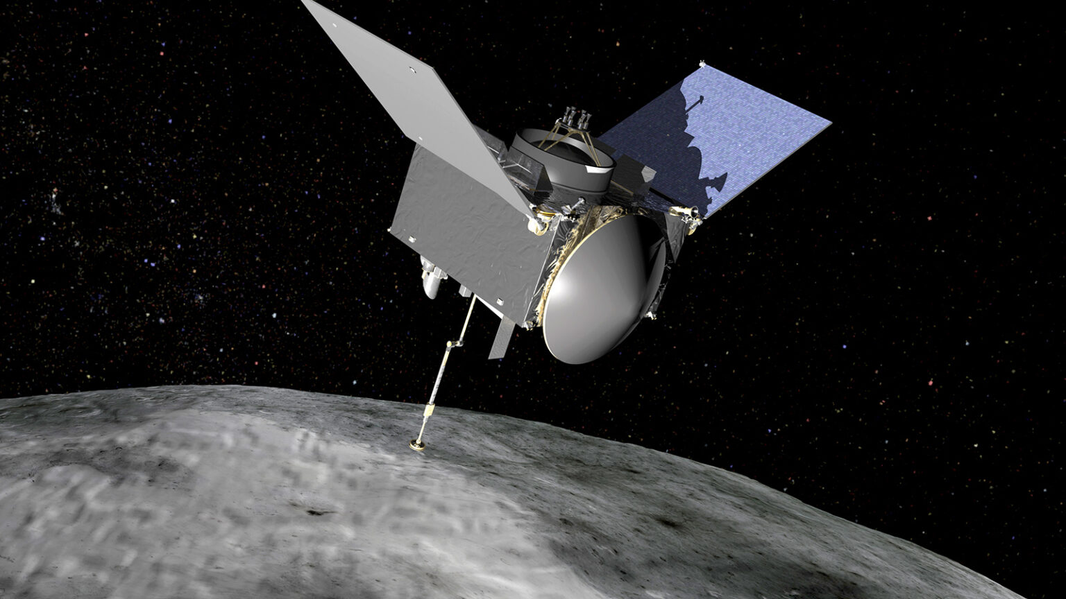 A spacecraft with solar panels and an extended sampling arm hovers above the rocky surface of an asteroid in the vastness of space.