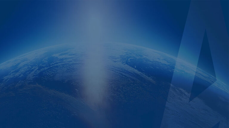 View of Earth from space with a blue gradient background and a subtle triangular overlay.