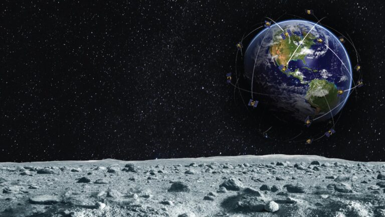 View of Earth from the Moon with numerous satellites orbiting Earth against a starry backdrop. The Moon's rocky surface is in the foreground.