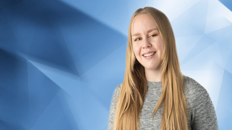 A person with long blonde hair is smiling. They are wearing a gray sweater, and the background consists of abstract blue and white geometric shapes.
