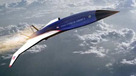 A sleek, dark aircraft with "United States of America" and an American flag emblem, flies over a cloud-filled sky.