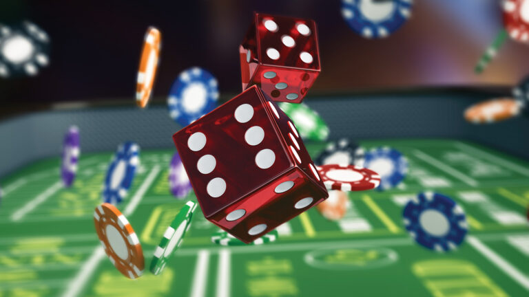 A close-up of red dice mid-air and poker chips scattered over a green casino game table.