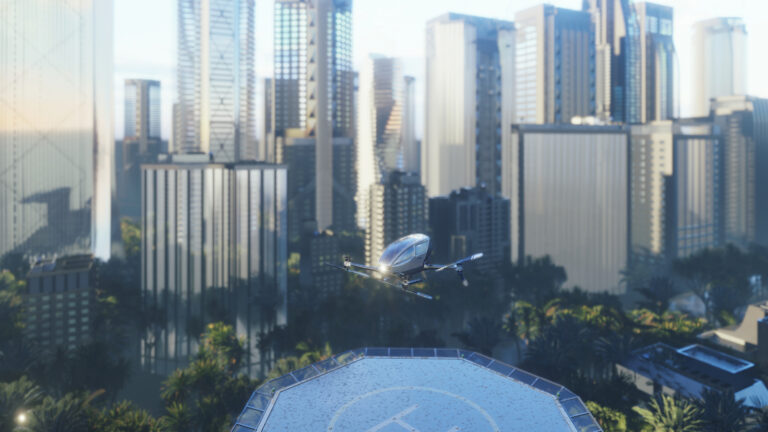 A drone is landing on a helipad in a city with tall skyscrapers and modern buildings in the background.