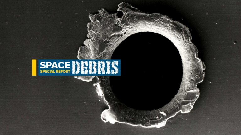 An image showing a close-up view of space debris with a black center and rough edges. The text "SPACE SPECIAL REPORT DEBRIS" is overlaid on the left side.