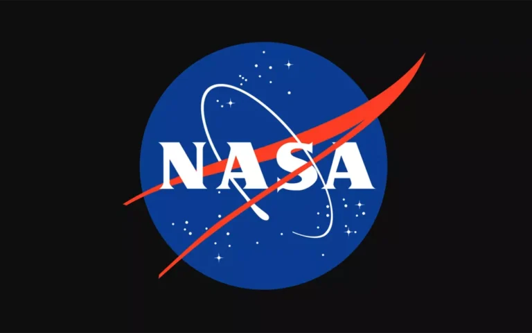 NASA logo featuring a blue circular background with white stars and an orbiting spacecraft. The red vector swoosh goes through the white letters "NASA.