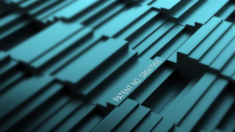 Abstract geometric pattern in shades of blue with the text "PATENT NO: 08641956" prominently displayed on one of the shapes.
