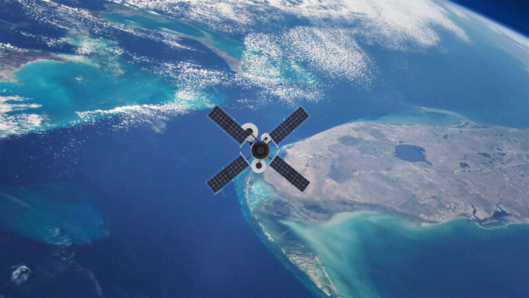 Satellite orbiting Earth above a coastline and ocean with visible landmass and water bodies.