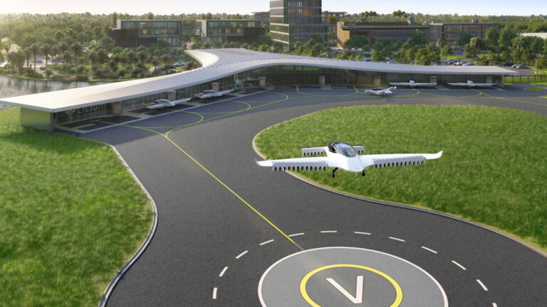 A small aircraft is landing on a helipad at a modern, green airport with surrounding buildings and clear skies.