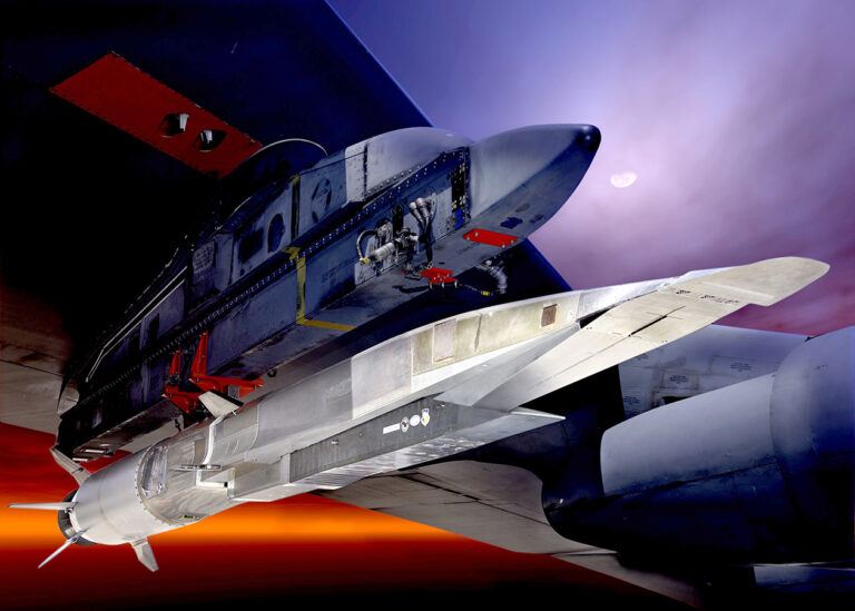 Hypersonics benefit from computational efficiencies A hypersonic aircraft is attached to the underside of a larger aircraft, ready for launch, with a dramatic sky in the background.