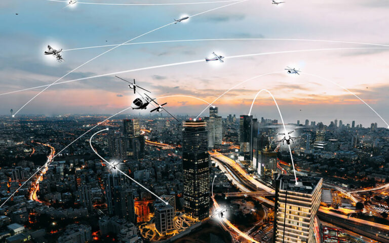 Cityscape at dusk with multiple flying drones connecting via tracked pathways above the illuminated buildings and streets.