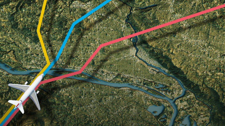 Aerial image of a jet airplane flying over a river with multiple colorful path lines indicating different flight routes across the landscape.