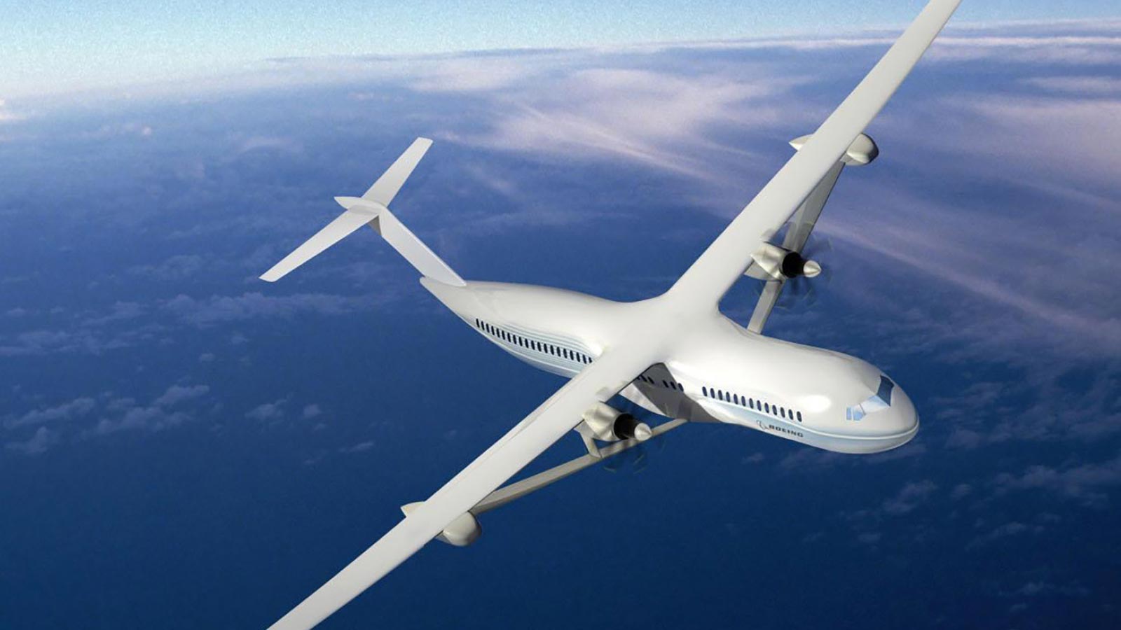 A white aircraft with two propellers is flying high above a layer of clouds, with a blue sky in the background.