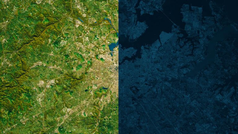 A satellite image showing a city and its surroundings. The left half is vibrant and detailed, while the right half is dark and less defined.