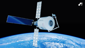A satellite with prominent solar panels and a cylindrical body orbits above the Earth with blue oceans and white clouds visible.