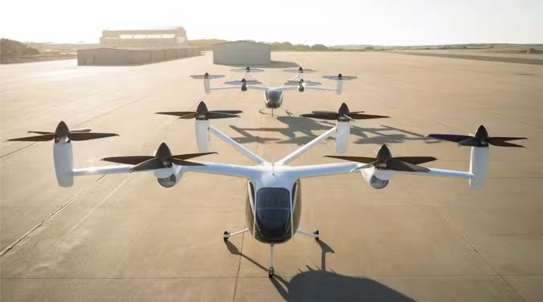 Two Joby S4 electric air taxis lined up