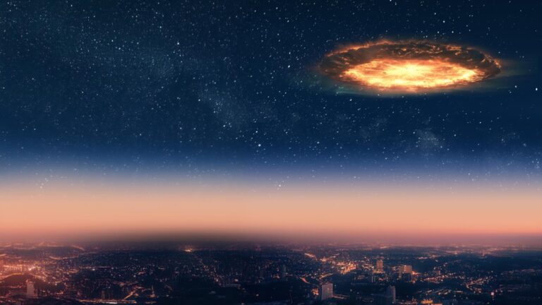 A glowing circular object hovers in the night sky above a cityscape illuminated with lights under a starry sky.