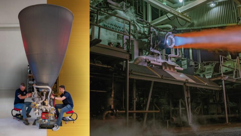 Two technicians work on a large rocket engine in a workshop. Next to them, the engine undergoes a test firing, emitting a bright flame and smoke in an industrial facility.