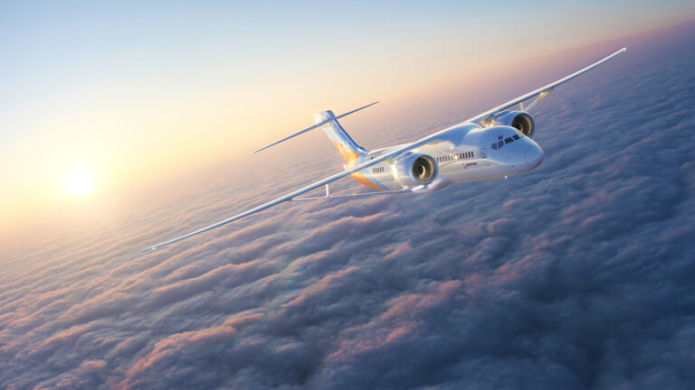 A large airplane flying above the clouds at sunrise.