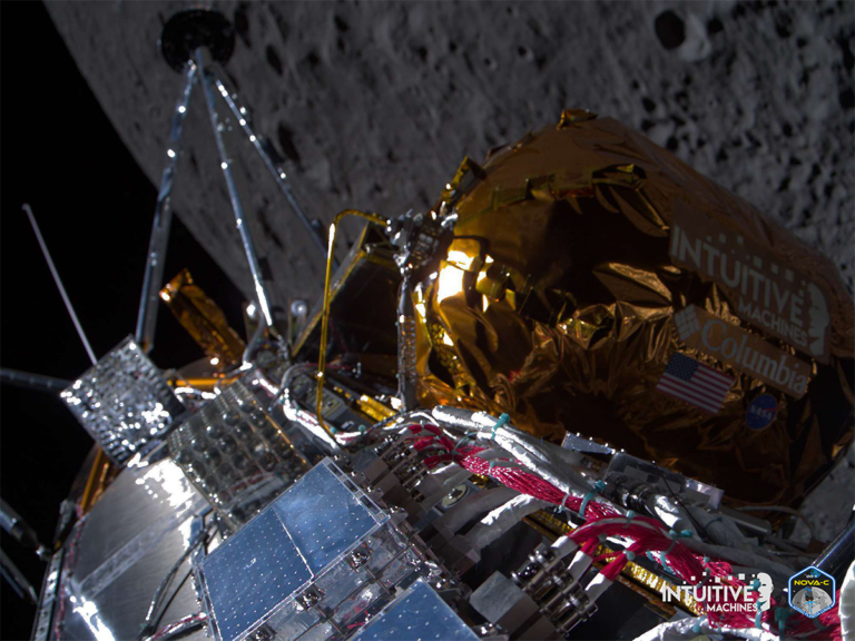 Technology for satellites and human spaceflight advances, as commitments to mitigating space debris strengthen Spacecraft near the moon with reflective panels and gold foil, branded "Intuitive Machines" and "Nova-C," against the moon's surface background.
