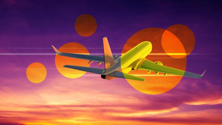 Airplane flying against a colorful sunset sky with abstract orange circles in the background.